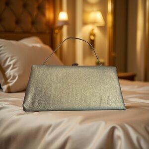 Vintage Bobbie Jerome Gold Clutch with Structured Design and Metallic Sheen